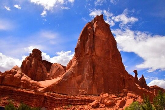 A tall red rock spire in Arches National Park