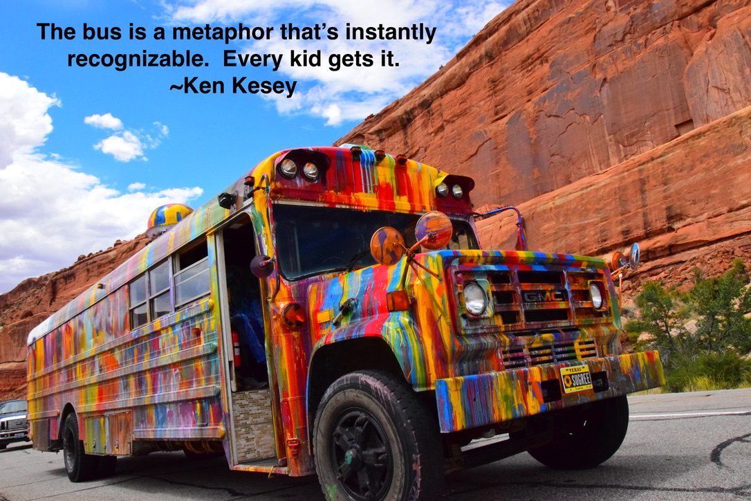 SUGAREE parked against red rock canyon walls, with a Ken Kesey quote overlaid: 'The bus is a metaphor that's instantly recognizable. Every kid gets it.'
