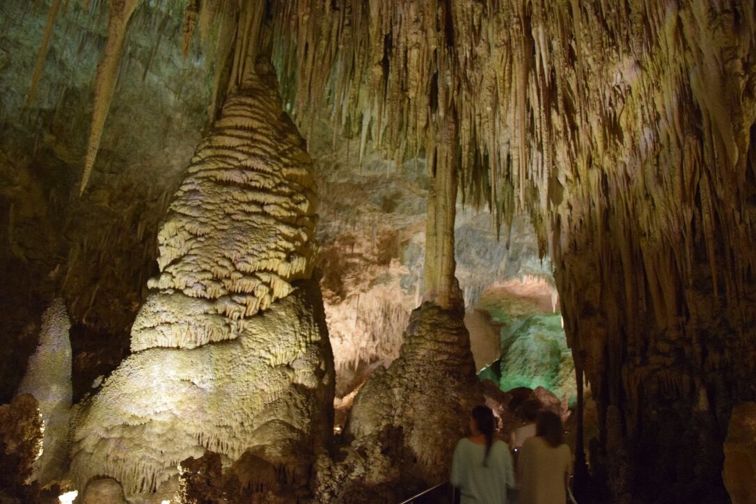 Towering stalactites and stalagmites inside a cavern