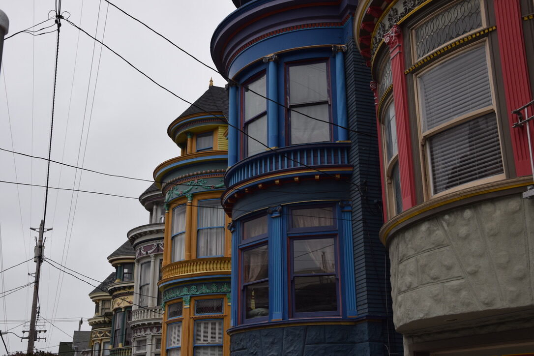 A row of colorful painted Victorian houses on Haight Street, San Francisco