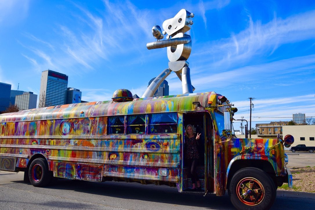 SUGAREE parked beneath the Traveling Man sculpture in Deep Ellum, Dallas