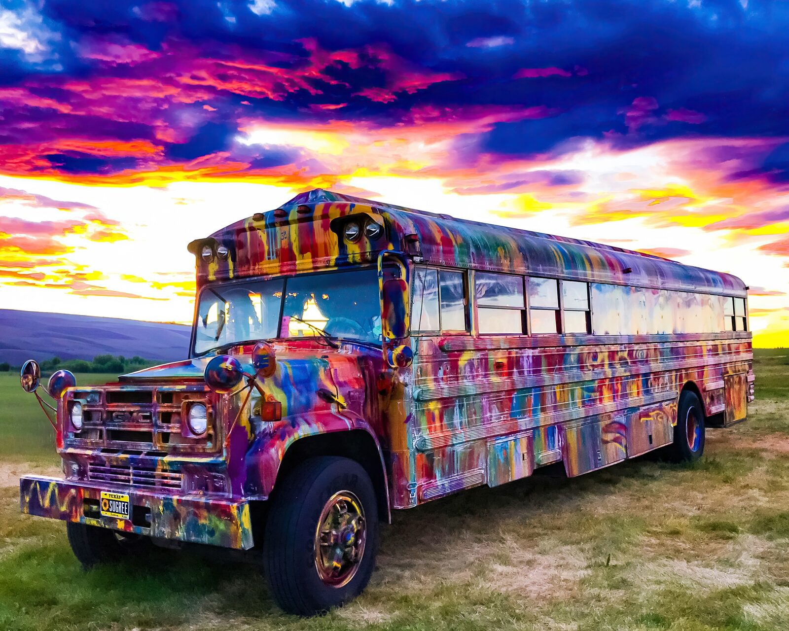 SUGAREE parked in a field under a dramatic purple and orange sunset sky