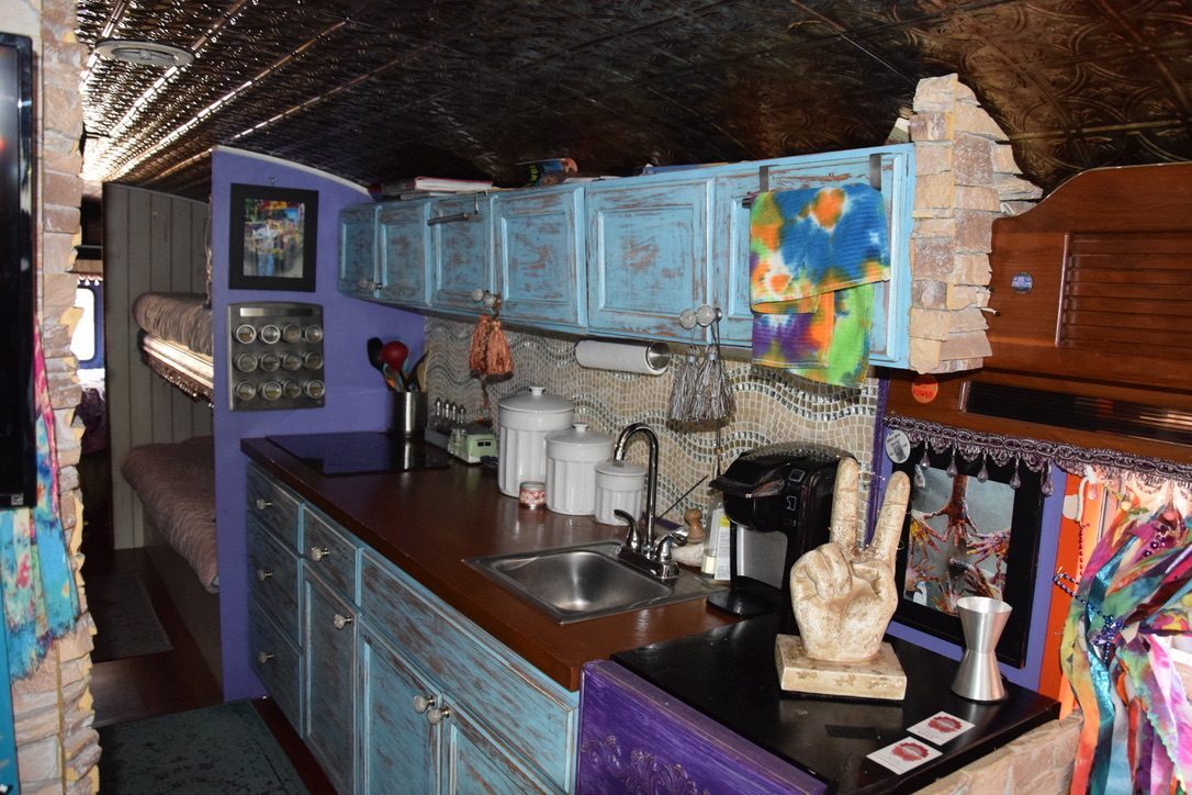 SUGAREE's small kitchen galley, tin ceiling and hand-painted cabinets