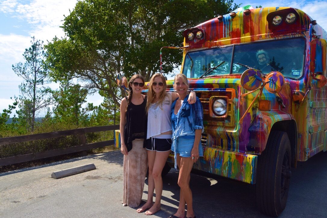 Three women standing in front of SUGAREE at a scenic overlook