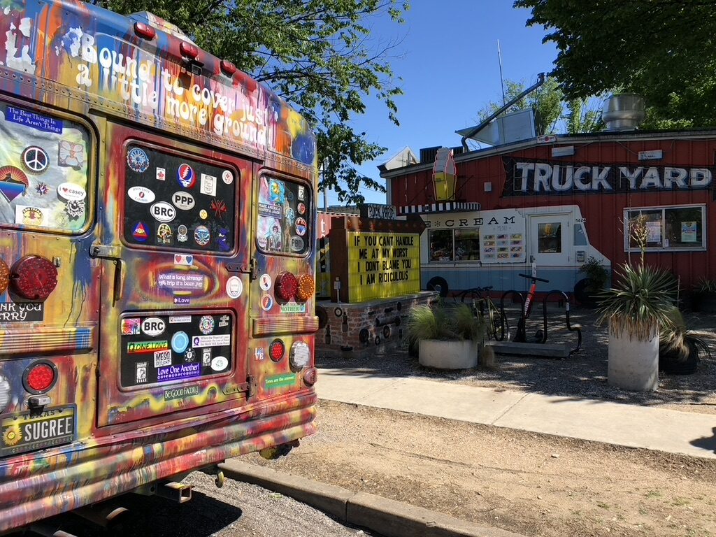 SUGAREE's rear end parked outside the Truck Yard restaurant, covered in stickers