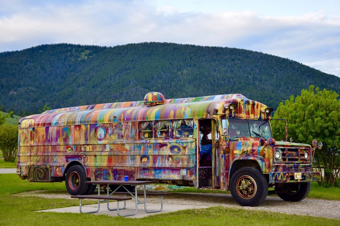 SUGAREE parked in front of a forested mountain